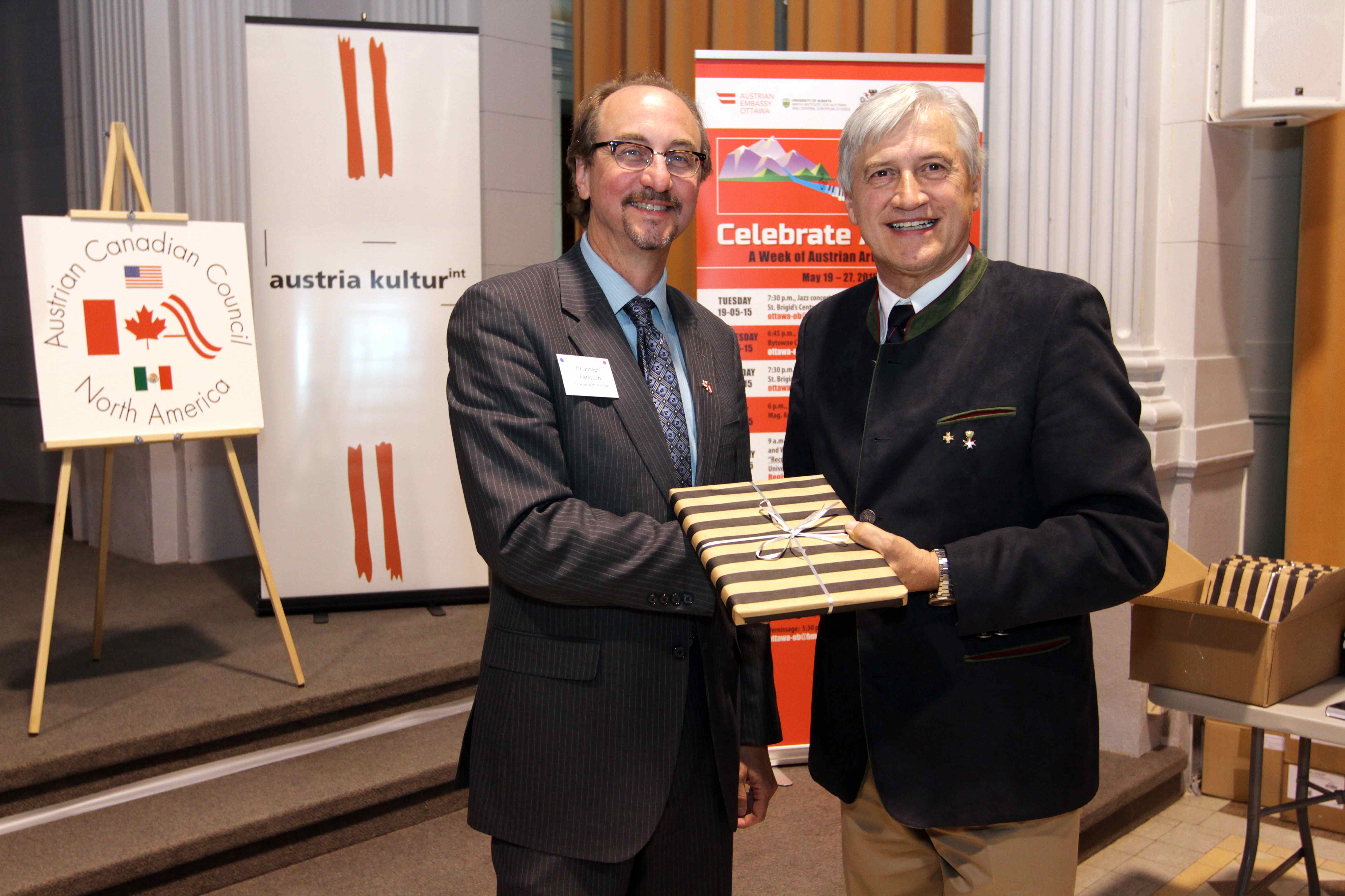 ACC Pres. Pirker presents Dr. Patrouch with a copy of the Anniversary Book